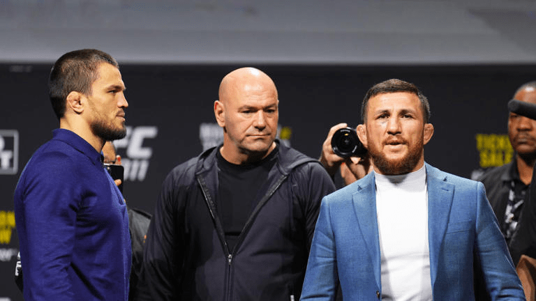 Three men at a press conference.