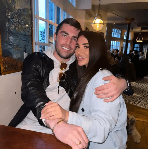 Couple embracing at a restaurant.