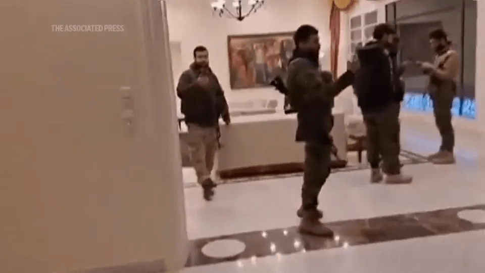 Rebel fighters seen raiding Assad's palace after the tyrant fled to Russia