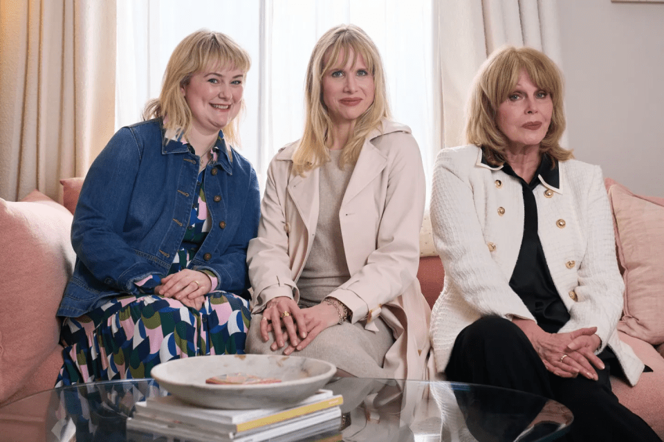 Three women sitting on a couch.