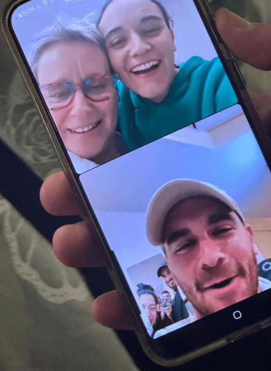 Smartphone displaying a multi-person video call.