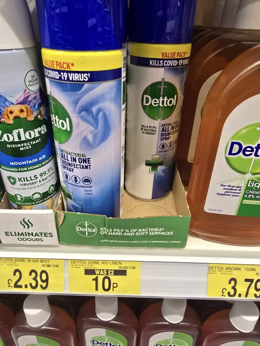 Dettol disinfectant spray and other cleaning products on a store shelf.