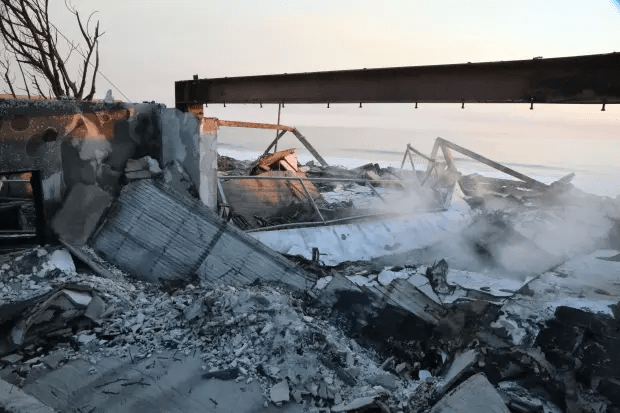 Burned-out building near the ocean.