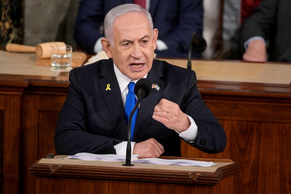 Benjamin Netanyahu speaking at a podium.