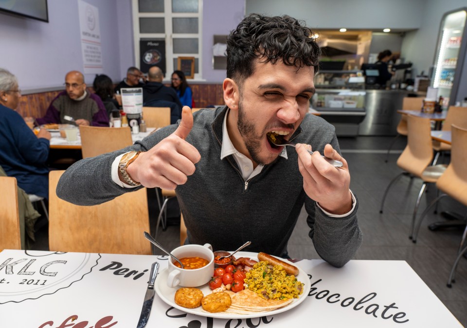 Man enjoying a large Indian curry-inspired fry-up breakfast.