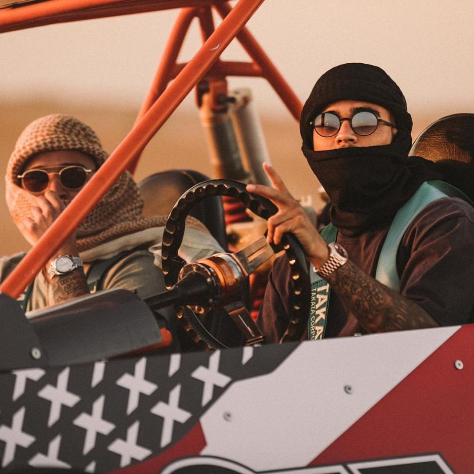 Two men in a dune buggy.