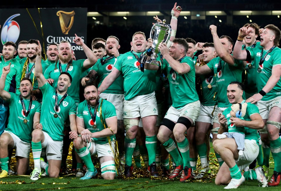 Irish rugby team celebrating Six Nations victory.