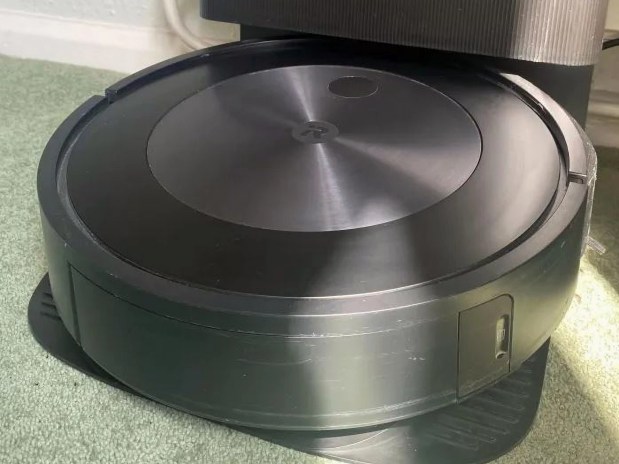 iRobot Roomba Combo j5 robot vacuum, sat on a carpet.