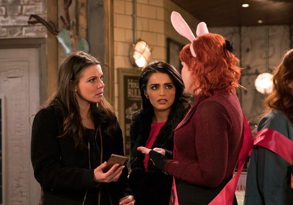 Three women at a hen party; one wears bunny ears.