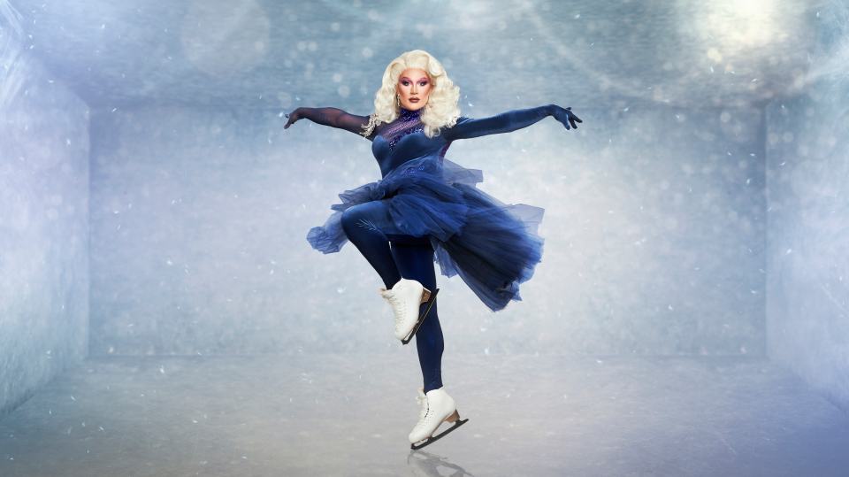 The Vivienne ice skating in a blue costume on Dancing on Ice.