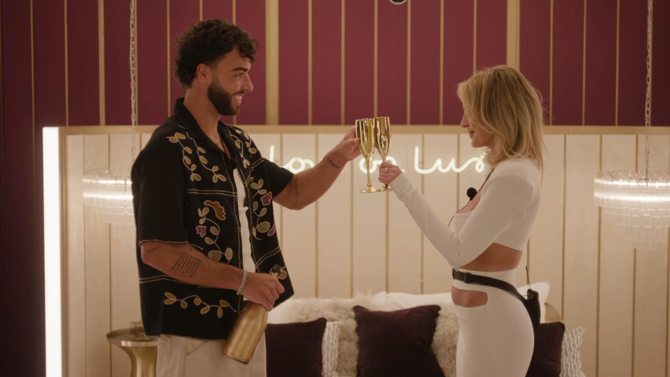 Sammy and Danielle from Love Island All Stars toasting with champagne.