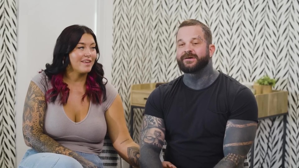 A bisexual couple sits and talks.