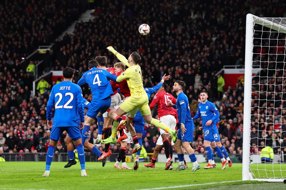 Jack Butland of Rangers punches the ball during a soccer match.