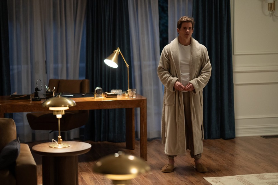 James Marsden as Cal Bradford in a bathrobe.