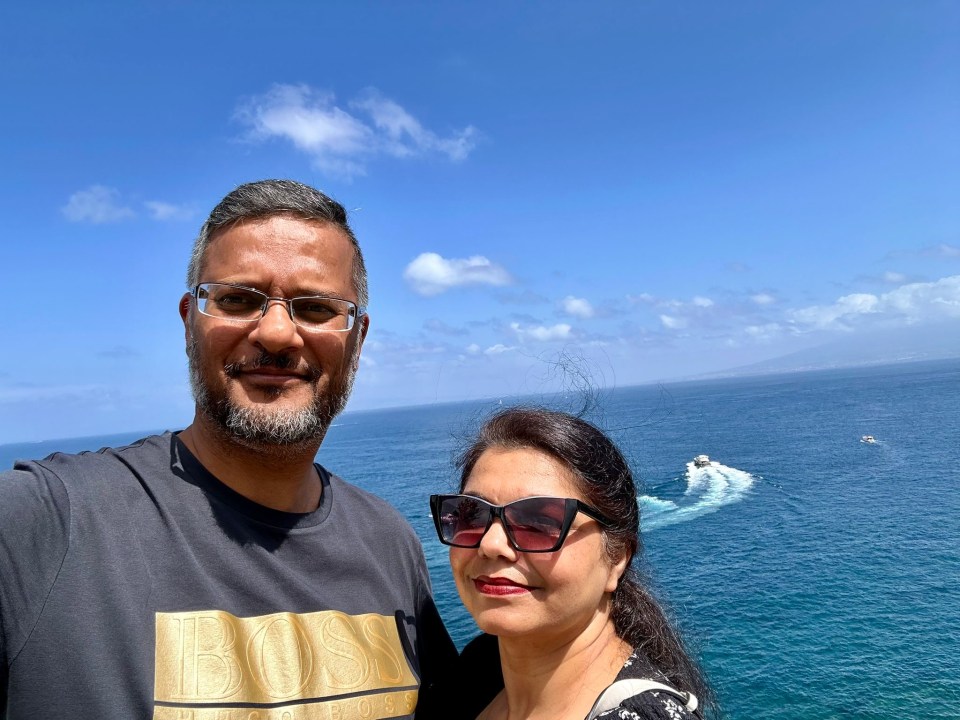 Jaspal Singh Bahara and a woman overlooking the ocean.