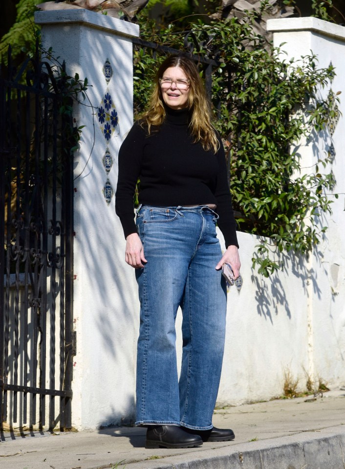 Jeanne Tripplehorn wearing jeans and a black sweater.