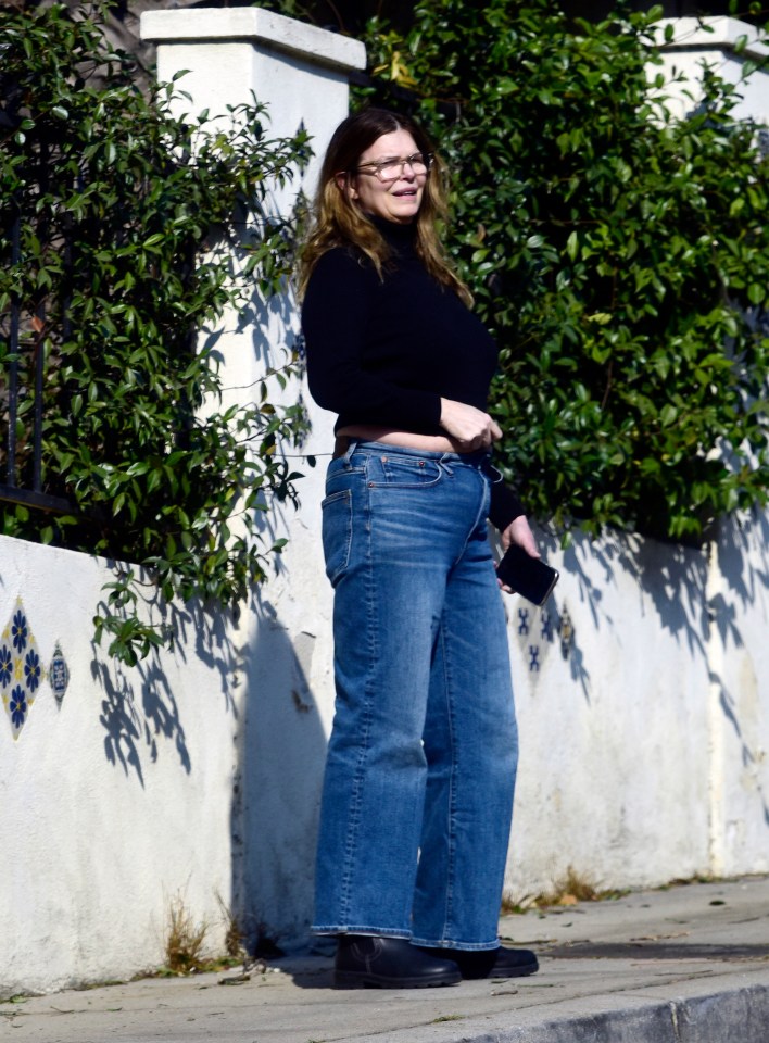 Jeanne Tripplehorn wearing jeans and a black sweater.