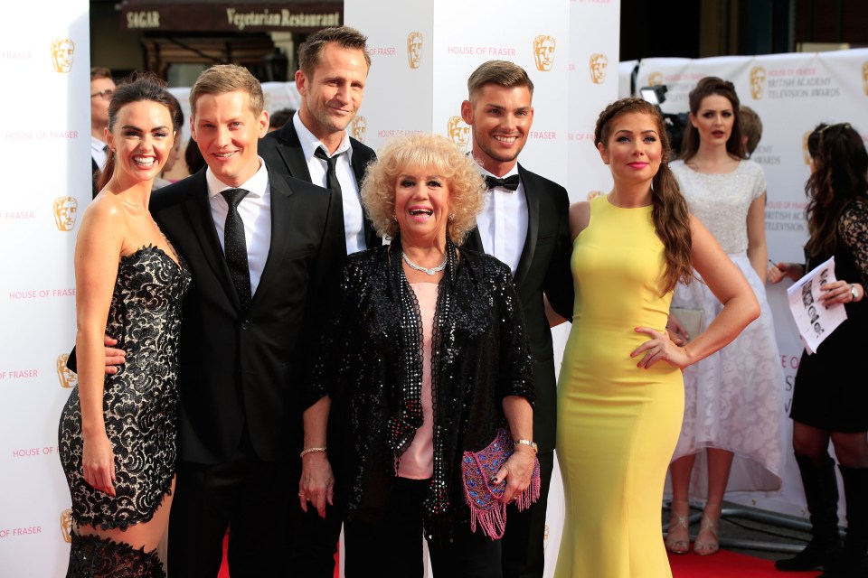 Group of actors at an awards ceremony.