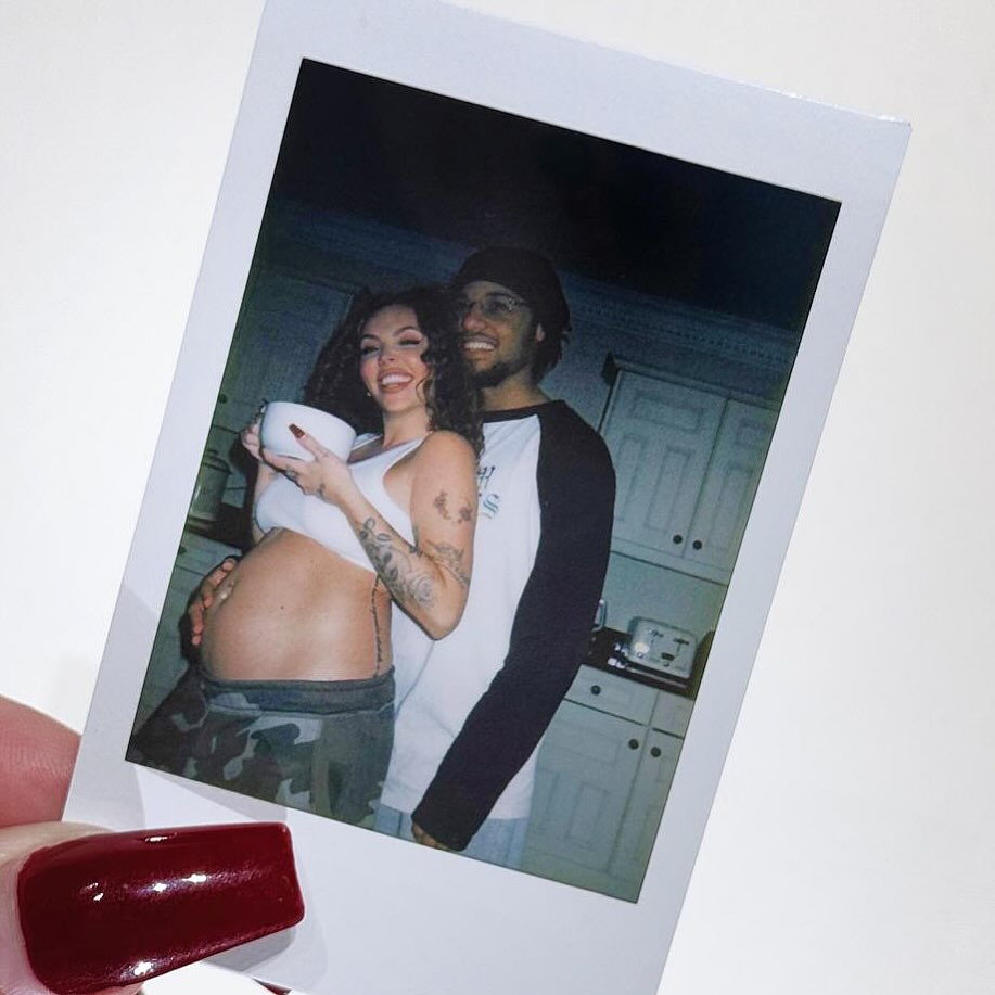 Photo of Jesy Nelson and her partner, showing her pregnant belly.