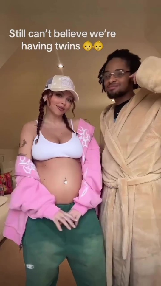 Pregnant woman and man announcing they are expecting twins.