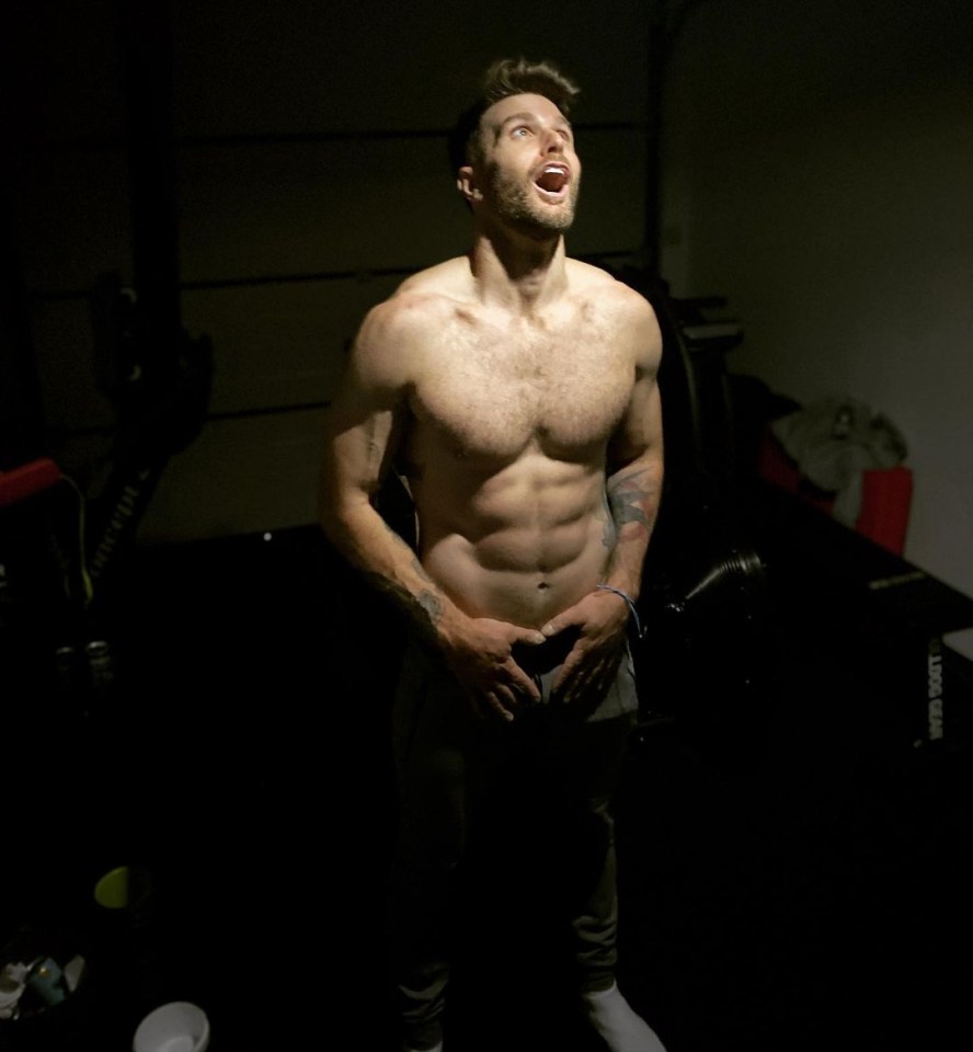 Joel Dommett shirtless in a gym.