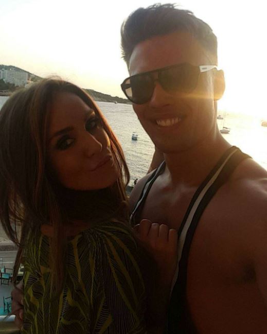 Jordan Wright and Vicky Pattison taking a photo together at sunset.