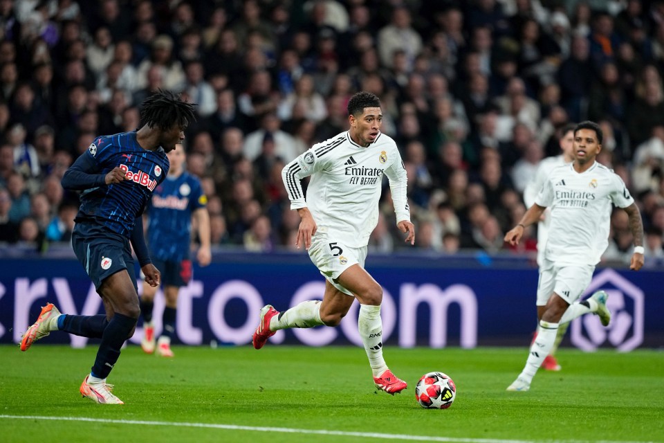 Jude Bellingham of Real Madrid dribbling the ball during a soccer match.