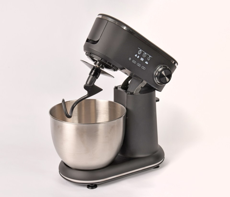 Black stand mixer with a stainless steel bowl and dough hook.