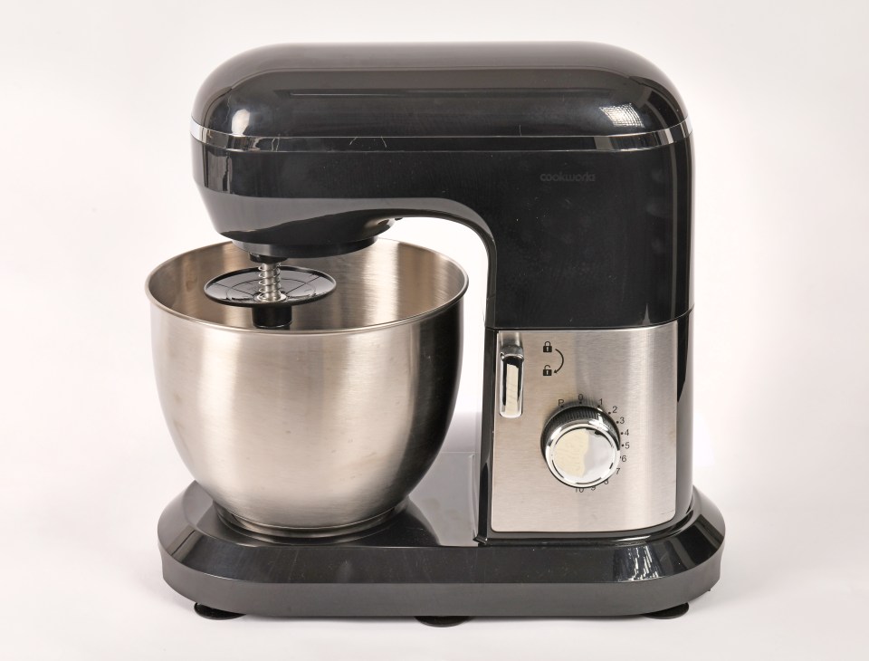 Black and silver stand mixer with stainless steel bowl.