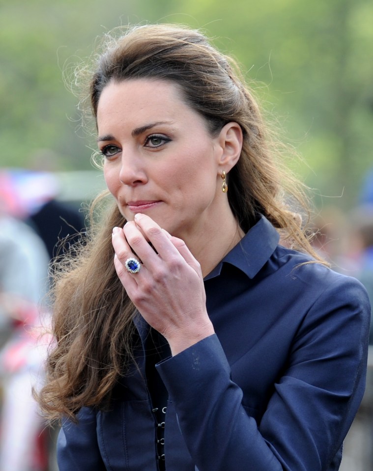 Kate Middleton wearing a sapphire engagement ring.