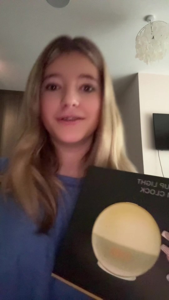 Katherine Ryan's daughter showing off a large gift.