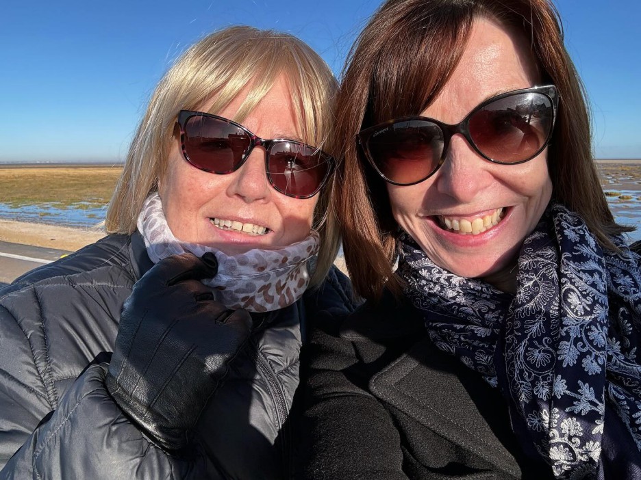 Selfie of two women outdoors.