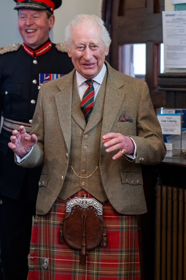 King Charles III visiting a charity.