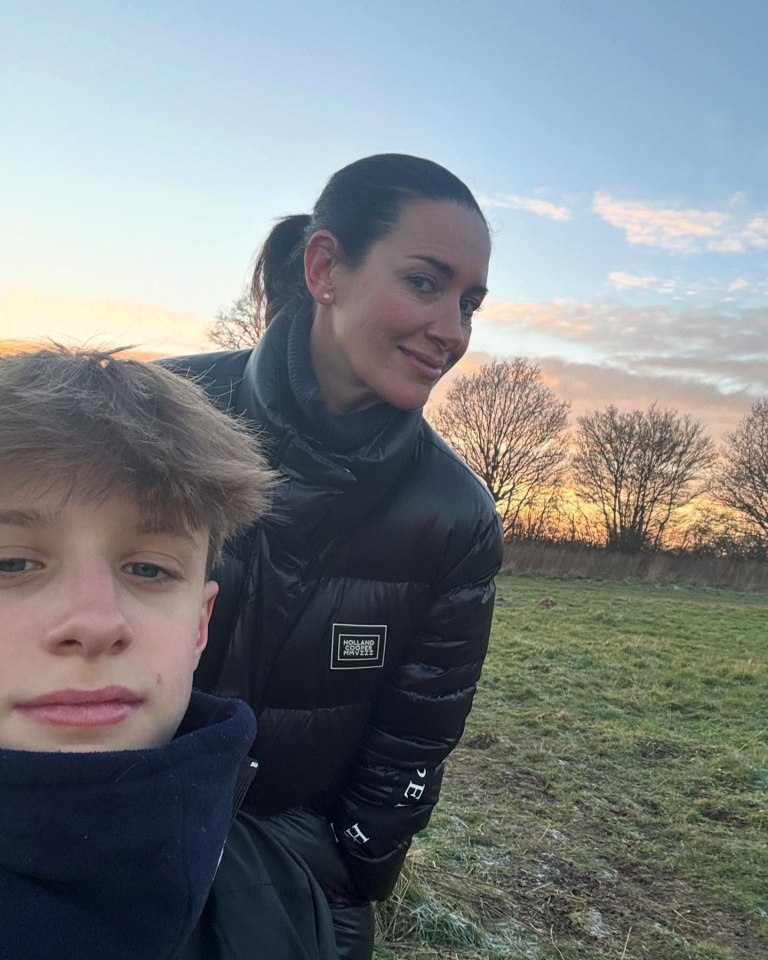 Woman and teenage boy outdoors at sunset.