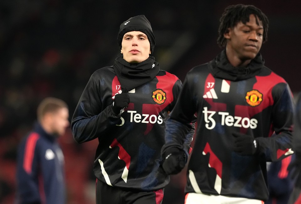 Manchester United's Alejandro Garnacho and Kobbie Mainoo warming up before a Premier League match.