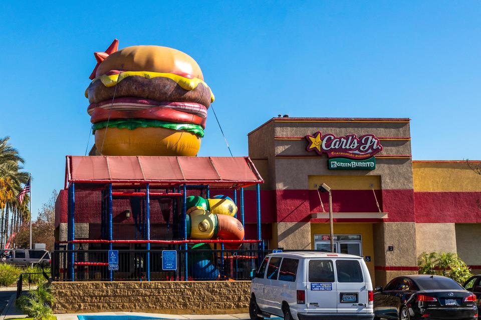 Carl's Jr. restaurant with a large inflatable burger.