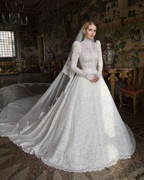 Lady Kitty Spencer in a long-sleeved white lace Dolce & Gabbana wedding gown.