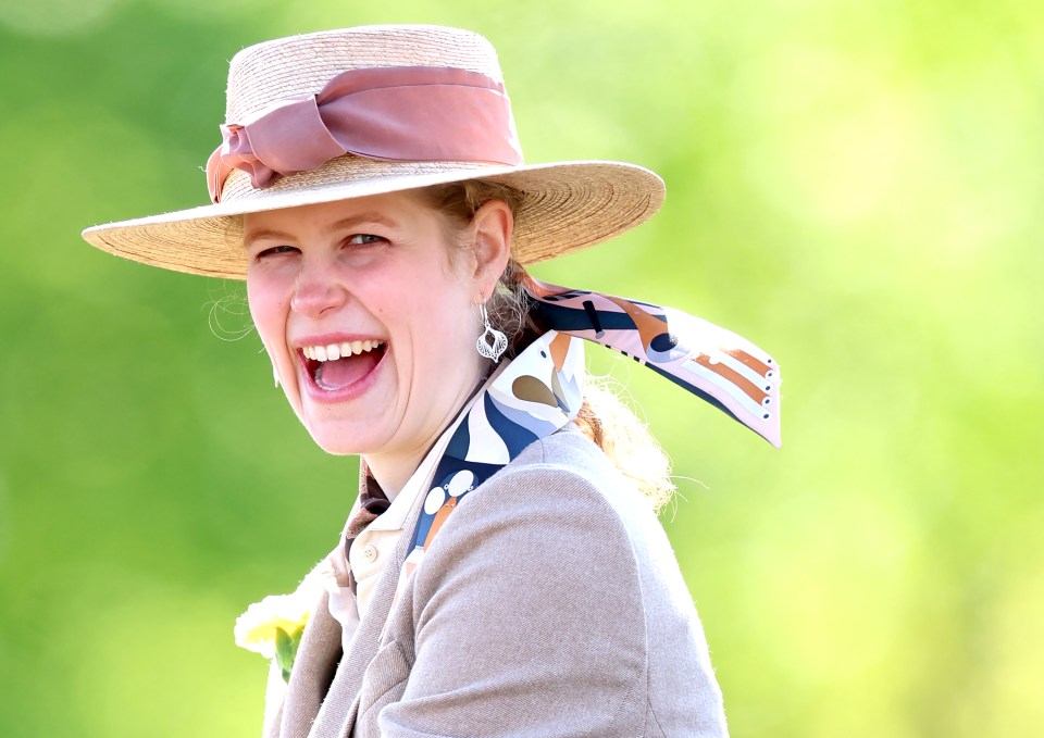 Lady Louise Windsor laughing at a carriage driving event.