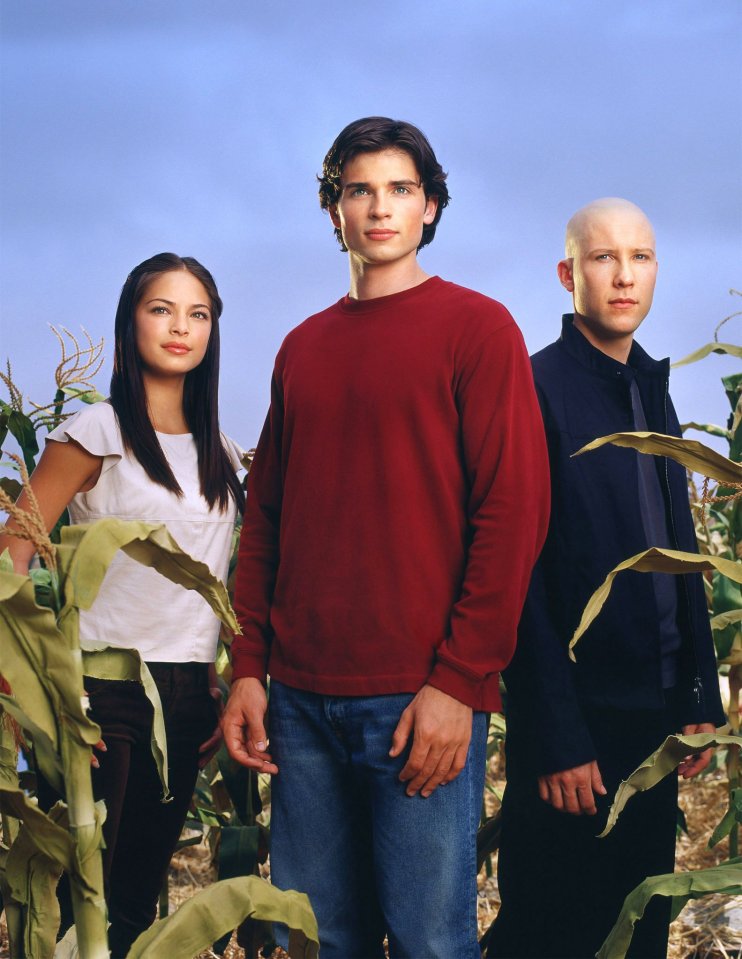 Promotional photo of the cast of Smallville: Tom Welling, Kristin Kreuk, and Michael Rosenbaum.