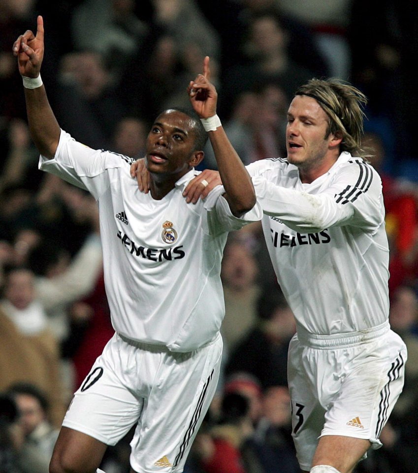 Robinho and David Beckham celebrating a goal.