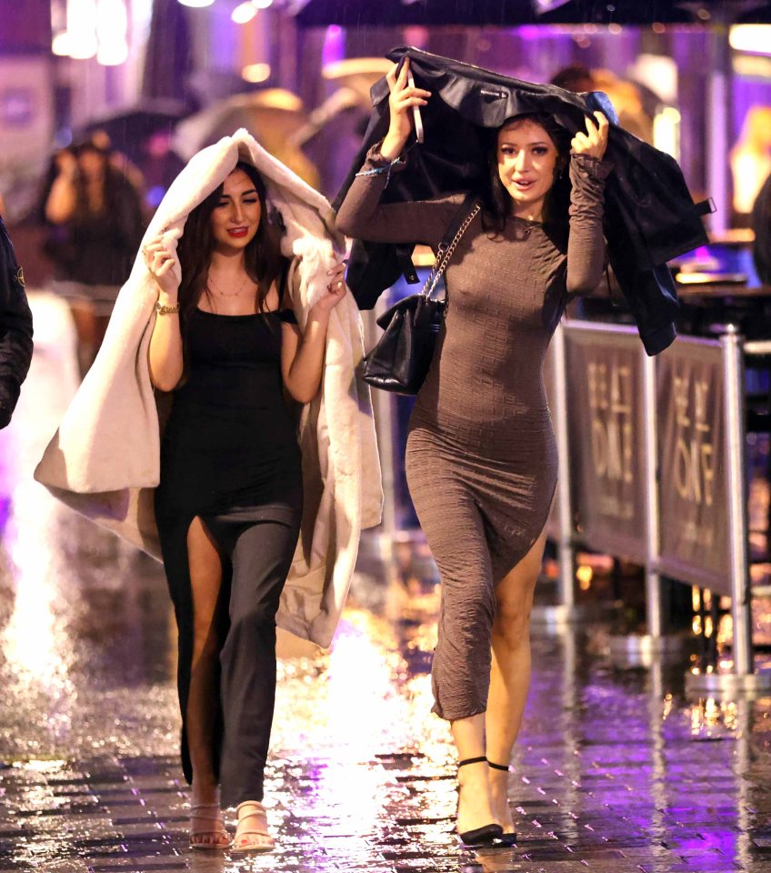 Revellers in Leeds strolling through the rain