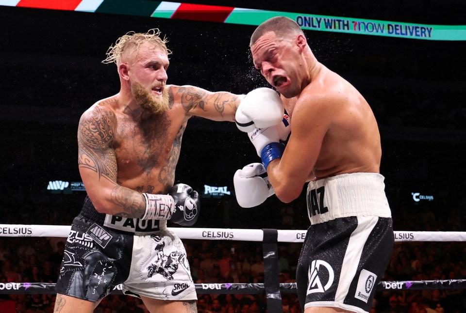 Jake Paul punches Nate Diaz in a boxing match.