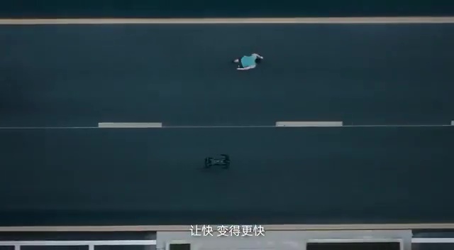 Aerial view of a person running on a road, being outrun by a small robot.