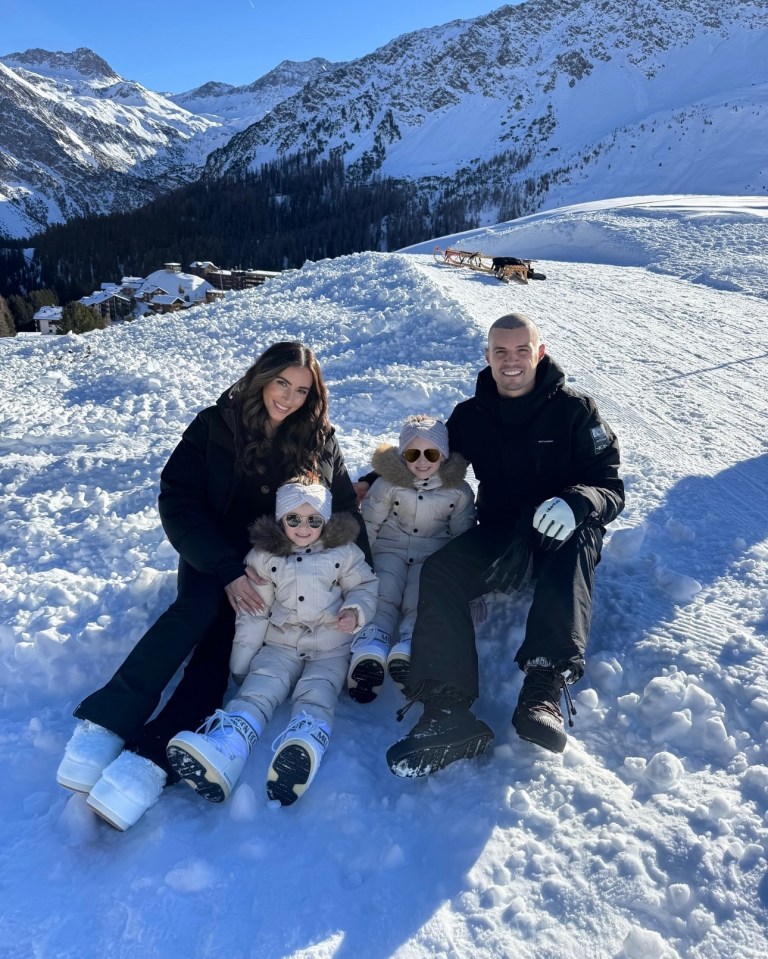 Family in snowy mountains.