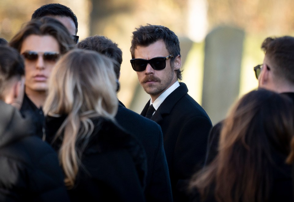 Harry Styles at a funeral service.