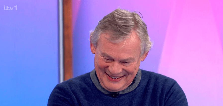 Martin Clunes laughing.