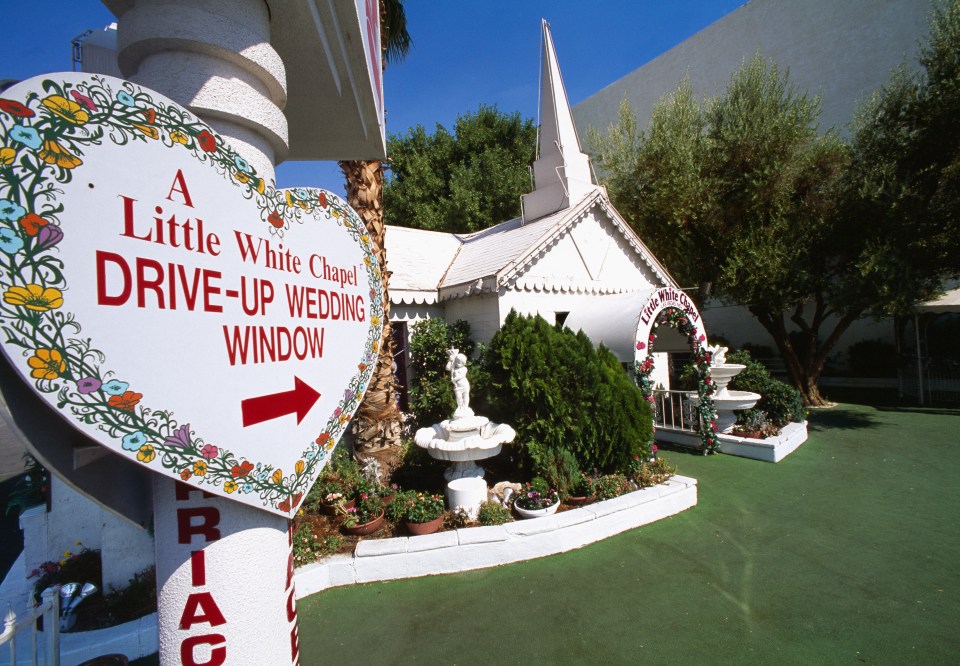 Sign for Little White Chapel drive-up wedding window.