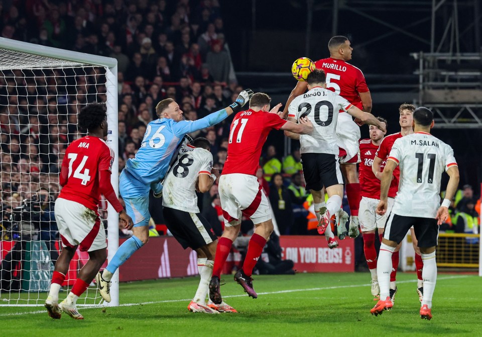 Diogo Jota heads a goal during a soccer match.