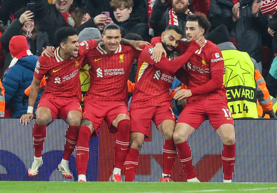 Liverpool players celebrating a goal.