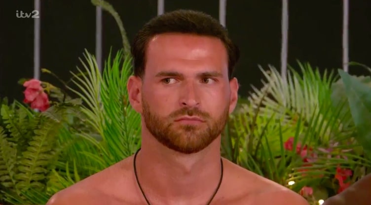 Ronnie from Love Island looking serious.